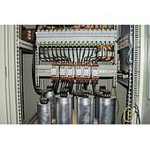 What is a capacitor bank? Define the concept of a capacitor and its operating principle