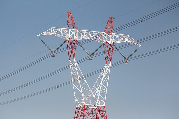 Electrical transmission tower with a duplex coating system